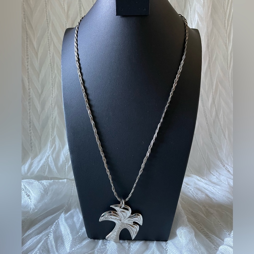 Silver tone palm tree pendant with braided chain necklace